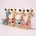 Chic giraffe metal keychains featuring sparkling crystal rhinestones in four vibrant colors - Random Color