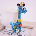 Portachiavi giraffa dorato con strass blu scintillanti e decorazioni floreali - Blu lago