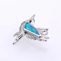 Detalle del colgante de pájaro con incrustación de ópalo azul verde y texturas metálicas - Plata Verde Opale