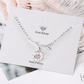 Elegant silver flower necklace with pink gemstone and branch pendant on display card - Silver/Pink Zirconia