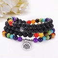 Bracciale in pietra lavica e pietre naturali con pendente a fiore di loto in argento - Stile Loto