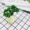 Artificial green berry stem in ceramic vase for home and wedding table decoration - Green