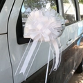 Detailed view of white macaron pull bow ribbon tied to a white car side mirror - 10 Strands Pack / Pastel White