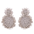 Detail of handcrafted cream beaded earrings with vintage geometric weaving and gold finish - Off White