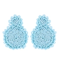 Detailed view of light blue handmade seed bead earrings with bohemian geometric weaving - Blue