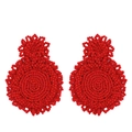 Detail of red handmade beaded earrings featuring a double circular drop design - Red