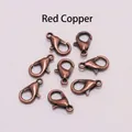 Macro shot of 8 vintage red copper alloy lobster clasps for DIY jewelry making and crafts - Antique Red Copper