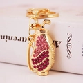 Pink rhinestone golf bag keychain with gold plating and sparkling gradient effect - Pink