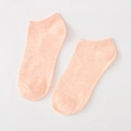 Light orange low-cut cotton socks for women, shown in a flat lay minimalist style - Standard Type / Orange