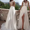 Elegant white lace wedding gown with pearl buttons and high slit on outdoor balcony - 3XL / Dresses / White