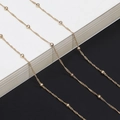 Elegant gold satellite glasses chain with fine twisted links and polished beads - Gold