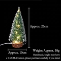 Close-up of mini cedar Christmas tree with warm LED lights and natural wooden base - Warm Light Style / 25cm