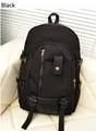 Large black canvas backpack with metal buckles and vertical zipper for outdoor travel - Black