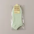 Pale green low-cut cotton boat socks with vertical ribs and retail card packaging - One Size / Fruit Green
