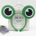 Cute green frog headband for kids with large eyes and a glittery silver crown decoration - Green Frog with White Glitter Crown