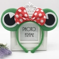Green plush frog headband featuring large eyes and a red polka dot bow for parties - Green Frog with Large Bowknot