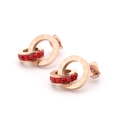 Boucles d'oreilles anneaux entrelacés or rose avec chiffres romains et cristaux rouges - Rouge
