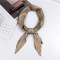Elegant champagne gold pleated silk scarf styled as a stylish necktie on white background - Khaki