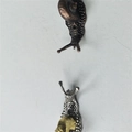 Miniature snail shaped incense holder accessory in bronze and silver metal finishes - Snail Incense Holder