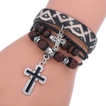 Multilayer leather bracelet with black wooden beads and silver cross pendants on wrist - Retro Branded Pattern