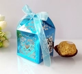 Detail of laser-cut heart pattern on blue metallic wedding candy box with ribbon - Reflective Blue