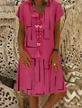 Close-up of V-neckline on rose pink dress with black geometric line patterns - S / Rose Red