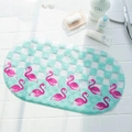 Oval green bathroom non-slip mat featuring pink flamingo patterns and suction cups - Flamingo