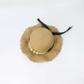 Detail of straw hat with scalloped wavy brim, black ribbon and elegant pearl accents - Khaki - Pearl Ribbon Wavy Brim