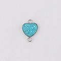Macro detail of a 13mm heart-shaped pendant with teal glitter resin and silver-tone frame - Blue-Green (18)