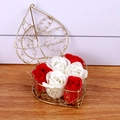 Detail of heart-shaped gold wire basket with six red and white soap roses for gifting - Red + White