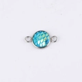 Close-up of a 10mm silver stainless steel pendant with blue iridescent mermaid scales - Teal Iridescent Scale (13)