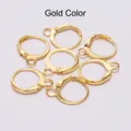 Close-up of golden lever-back earring hooks for DIY jewelry making findings - Gold