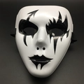 Detail view of a white Halloween mask with black hand-painted artistic patterns and straps - Single Arrow Style