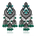 Detail of silver Jhumka earrings with green enamel beads and hollow carving design - Antique Silver Green