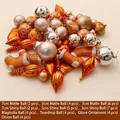50-teiliges Weihnachtsdeko-Set in Orange und Roségold mit verschiedenen Formen und Oberflächen - Bronze