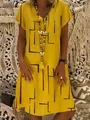 Detail of ginger yellow V-neck cotton dress with black geometric lines and tassel necklace - S / Yellow