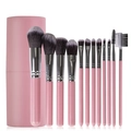 Set professionale di 12 pennelli da trucco rosa con custodia cilindrica su sfondo bianco - 12 Pezzi Rosa