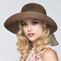 Elegant brown woven straw sun hat with wide brim and decorative ribbon for summer beach use - One Size / Dark Brown