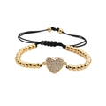 Pulsera de cuentas doradas con dije de corazón con circonitas y cordón negro ajustable - Dorado