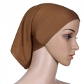 Close-up of a brown underscarf cap for women made of soft mercerized cotton fabric - Camel