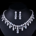 Elegant silver bridal jewelry set with sparkling teardrop AAA zirconia on black display - White