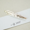 Elegant wavy golden alloy hair clip displayed on a minimalist white card for women - Wave (3529)