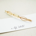 Elegant gold-finished metal hair clip with a geometric wave hollow design on white card - Number 8 (3527)
