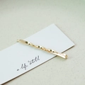 Elegant gold metal twist hair clip featuring a minimalist spiral design on white card - Large Twist (3533)