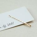 Elegant gold hair clip with wavy texture on a minimalist white display card - Smooth Bobby Pin (3534)