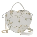 White heart-shaped handbag featuring yellow floral embroidery and gold chain strap - Heart / White