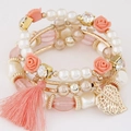 Multilayer bohemian bracelet with resin flowers, pearls, pink tassel and leaf pendant - Watermelon red