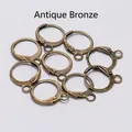 Macro shot of 9 antique bronze lever-back earring hooks for DIY jewelry making - Antique Bronze