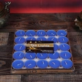 Box of 50 blue smokeless tea light candles in aluminum cups on a dark wooden table - Blue