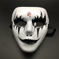 Detail showing hand-painted black eye patterns and red flame totem on white full face mask - Flame Pattern Style